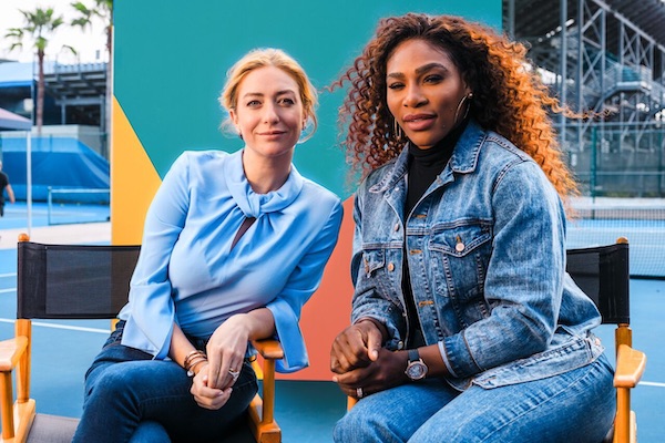 Serena Williams and Bumble sitting on a tennis court